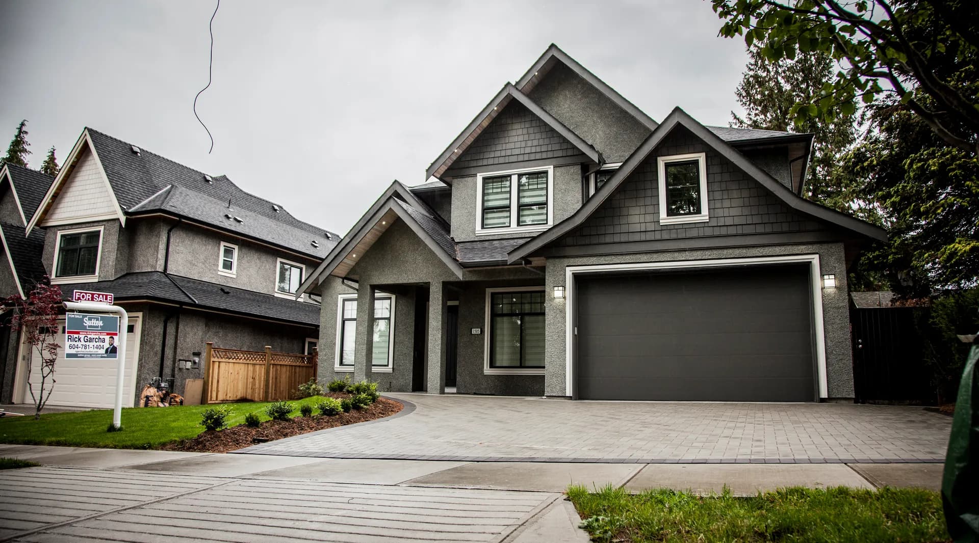 Coquitlam Custom, front exterior, grey two storey with shake gables and paver driveway