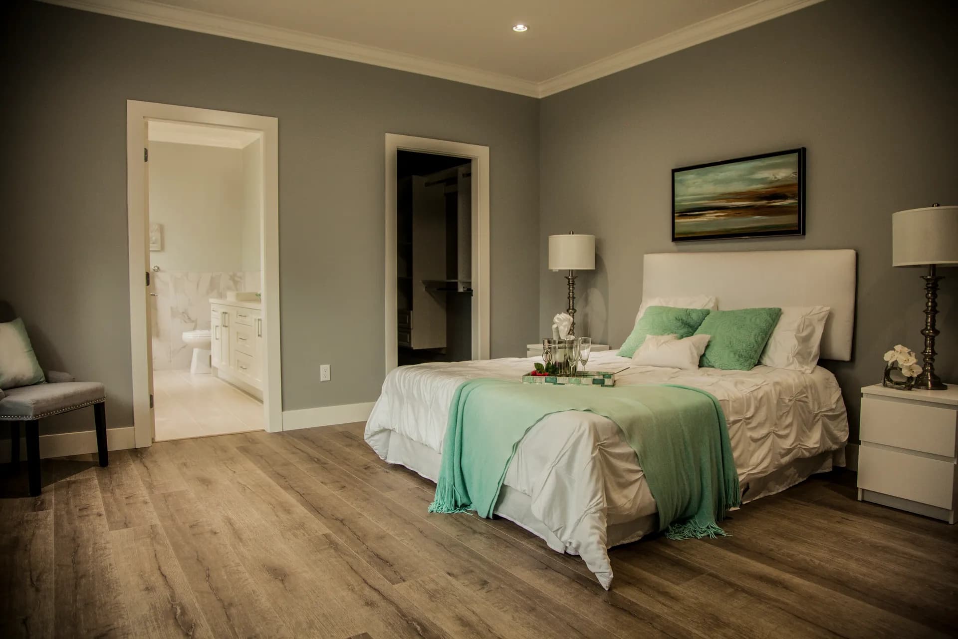 Primary bedroom with doors to the ensuite and walk-in closet