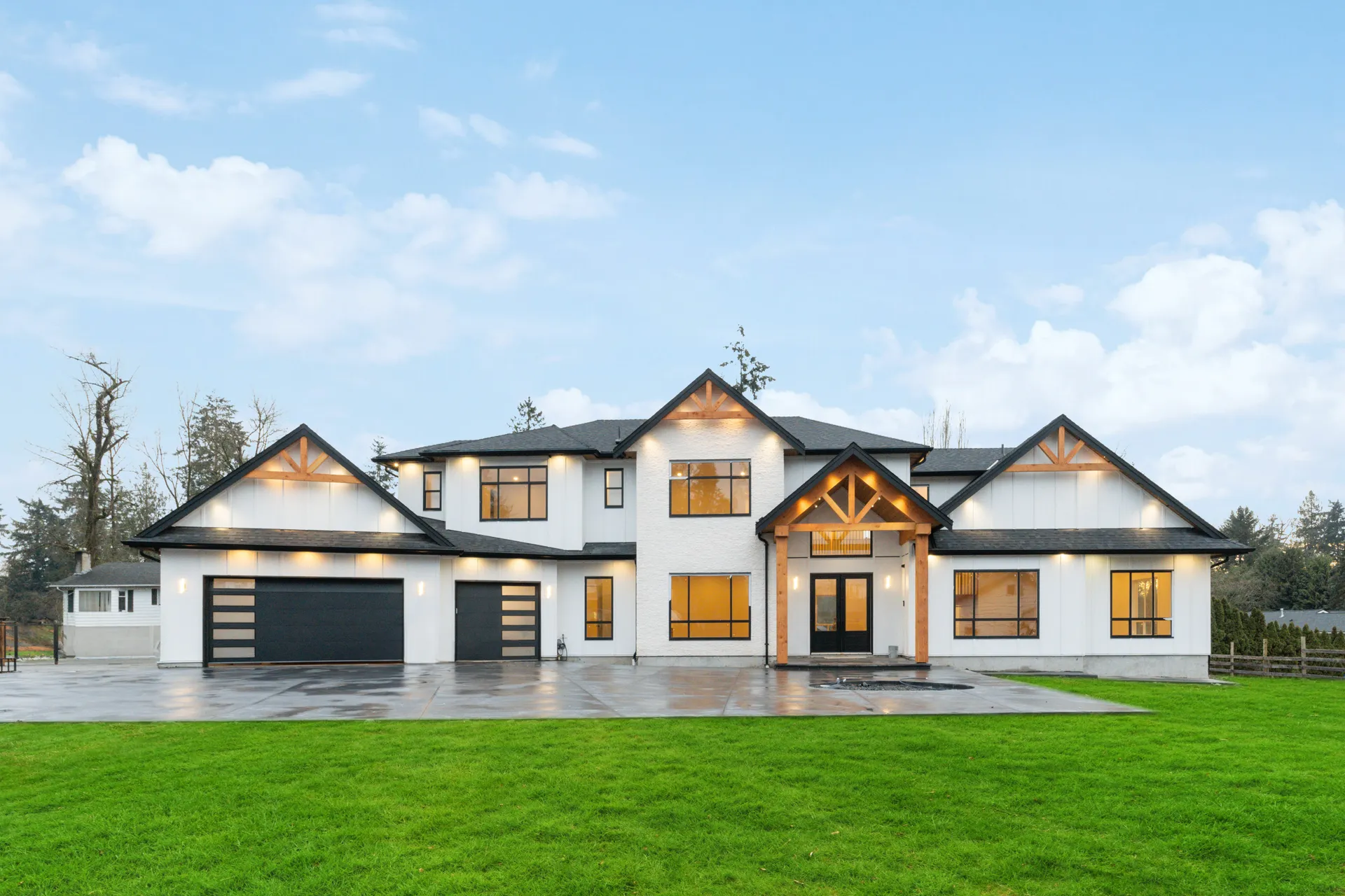Langley Modern Estate, daylight front exterior with timber gables and finished green lawn