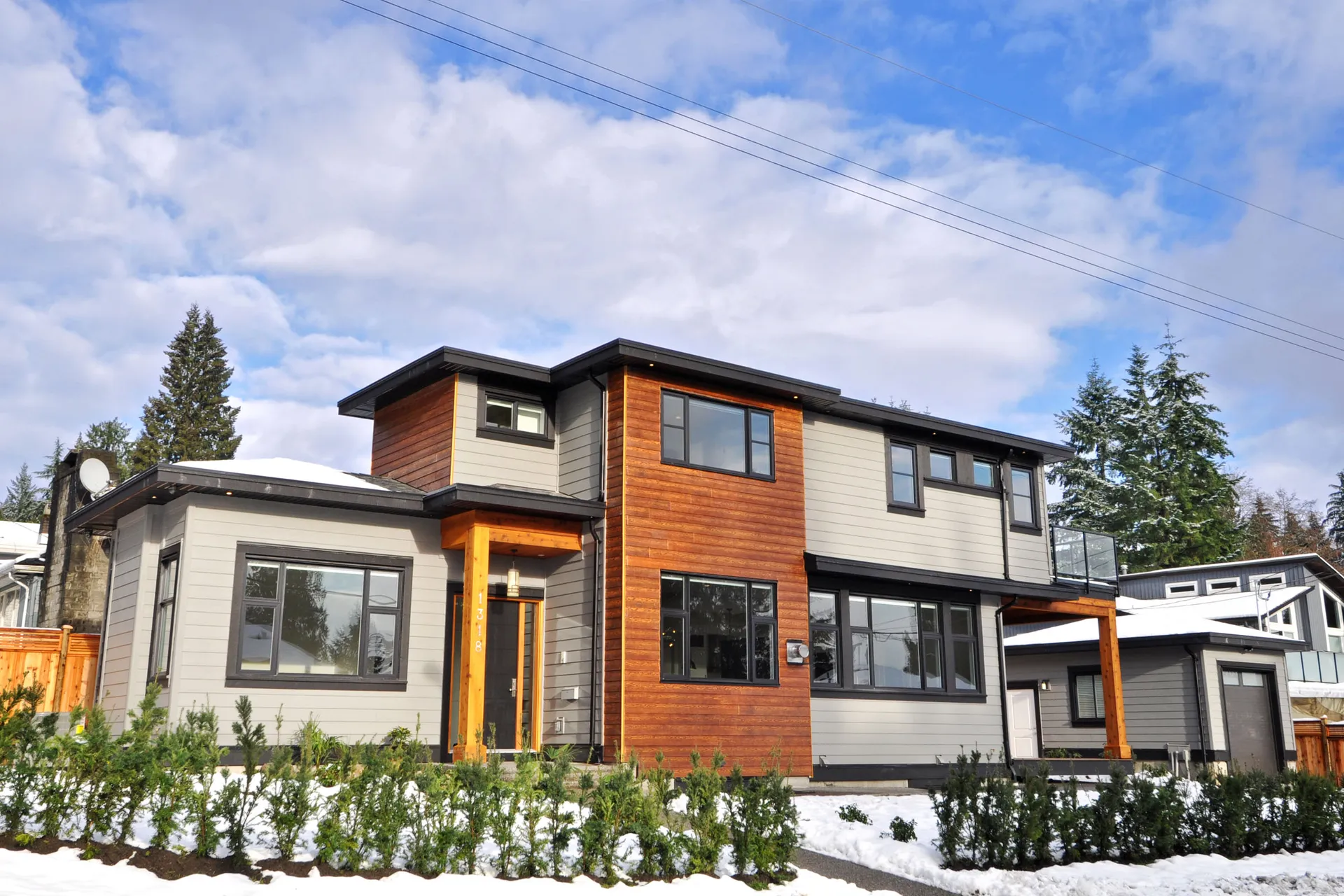 Lynn Valley family home front exterior with cedar tone and grey cladding