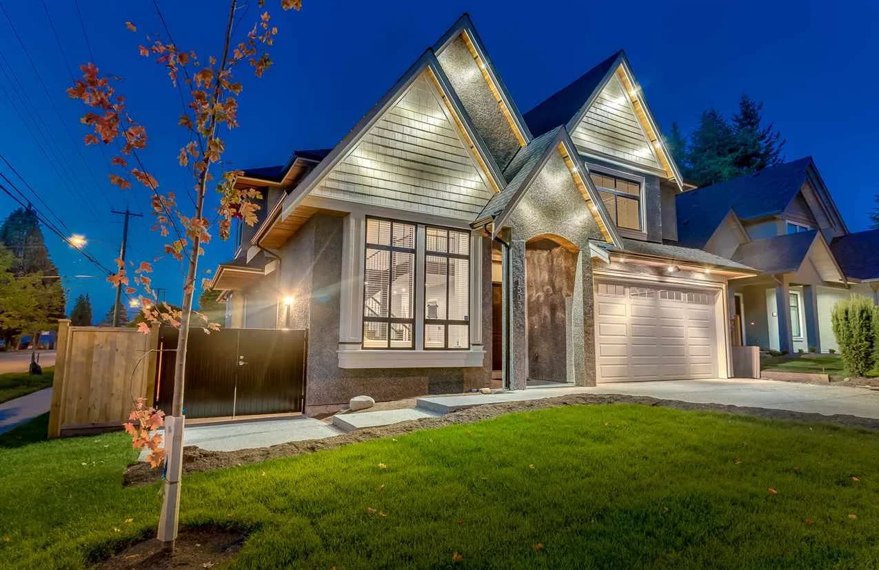 Coquitlam Modern, front exterior at twilight with gabled shake and stucco facade